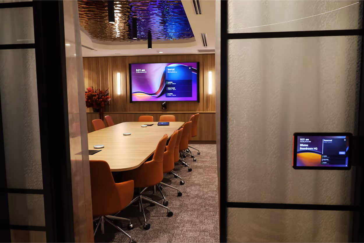 A Microsoft Teams Boardroom using components from Logitech, Yamaha, biamp, Shure and AVer with Teams Panel scheduling display.