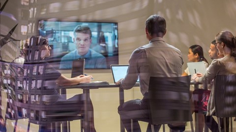 employees collaborating together in a video conference room