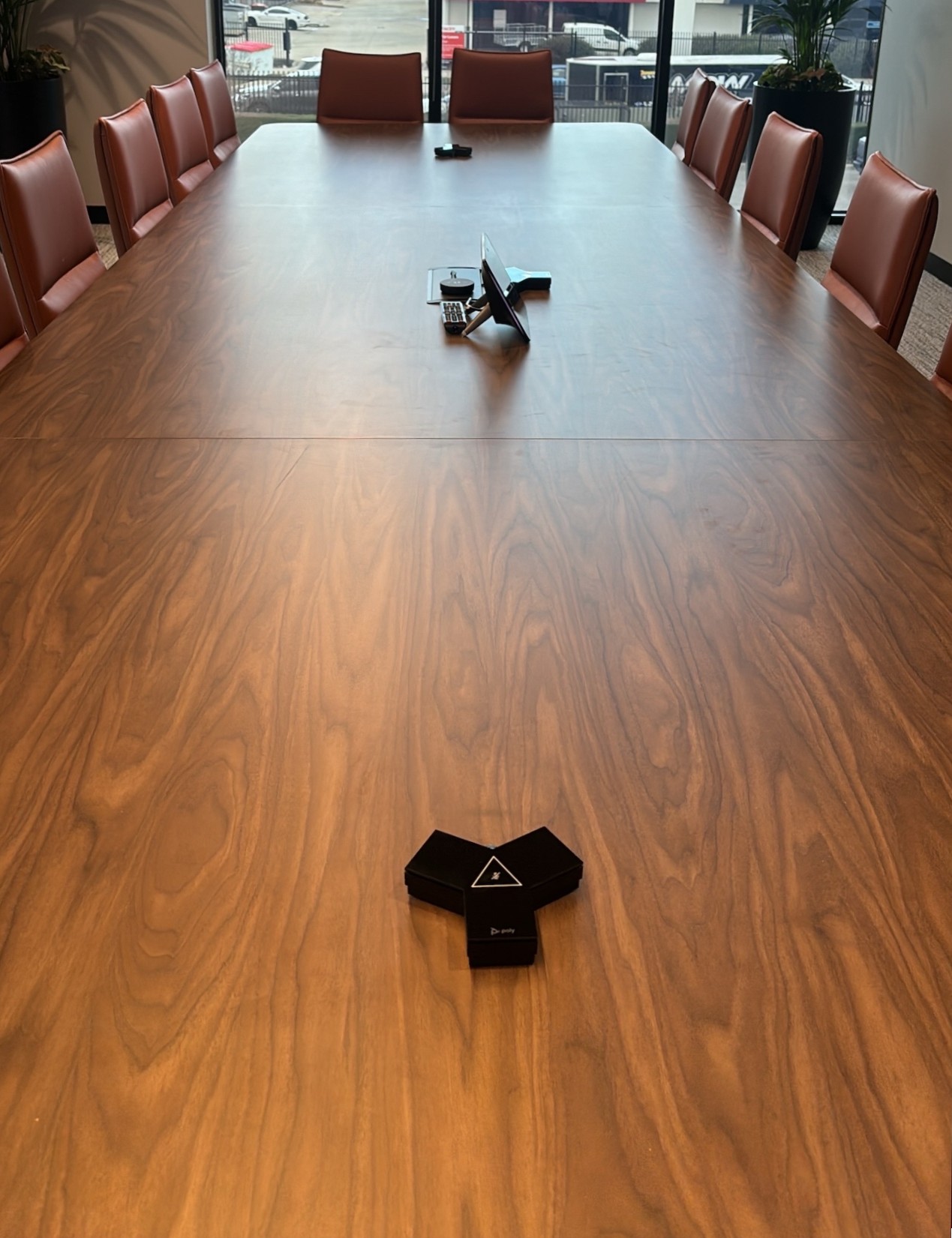 A large Microsoft Teams Boardroom using Crestron AirMedia for BYOD, HP | Poly X72 all-in-one video bar, HP | Poly TC10 control panel , HP | Poly G7500, Samsung 98" display.