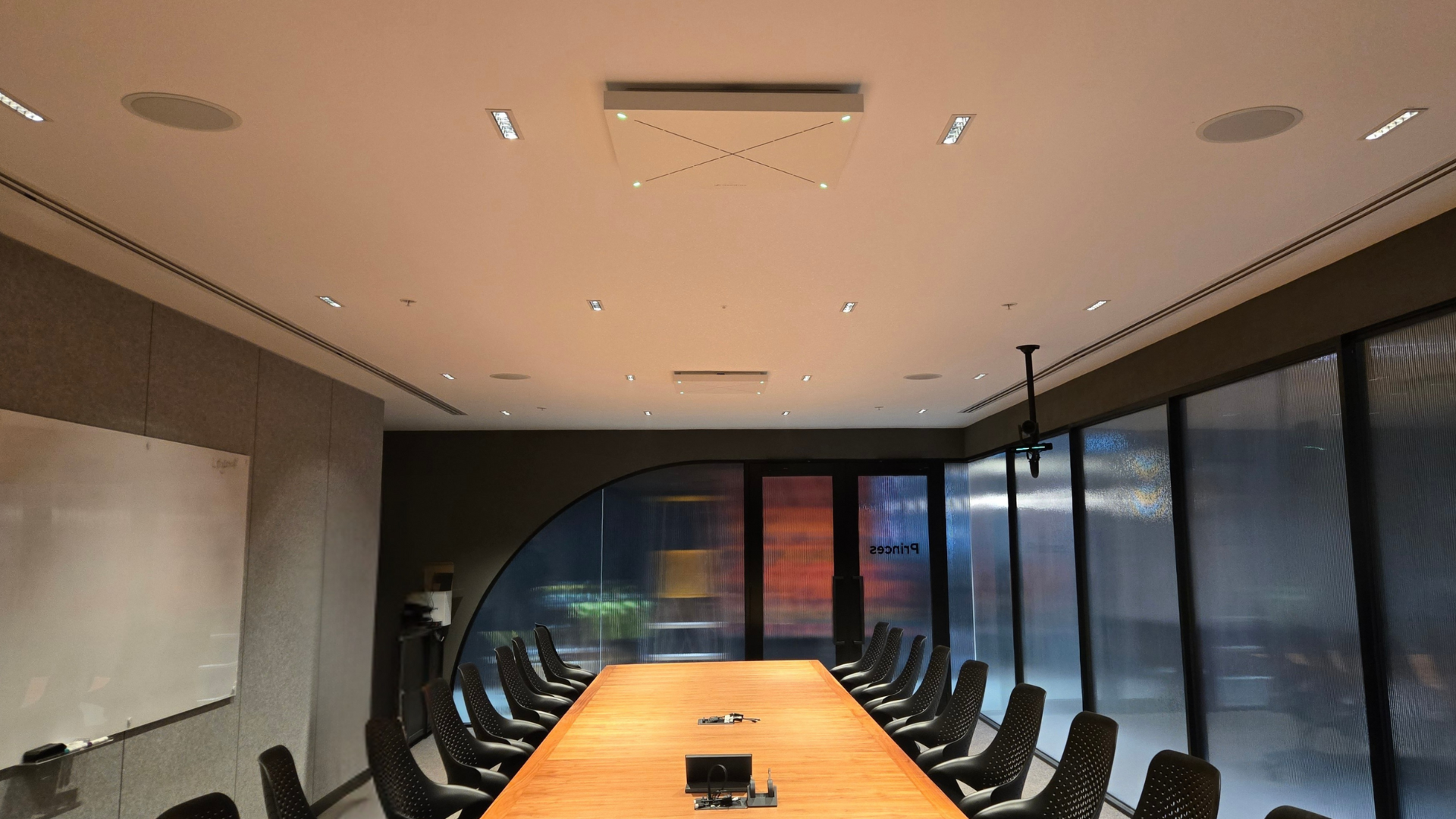 Large Microsoft Teams Room with Crestron 1 Beyond i12 Intelligent PTZ camera, Crestron TSW-1070 touch panel, Crestron ceiling speakers, NEC Corporation 98" display, Sennheiser TCC2 ceiling mic