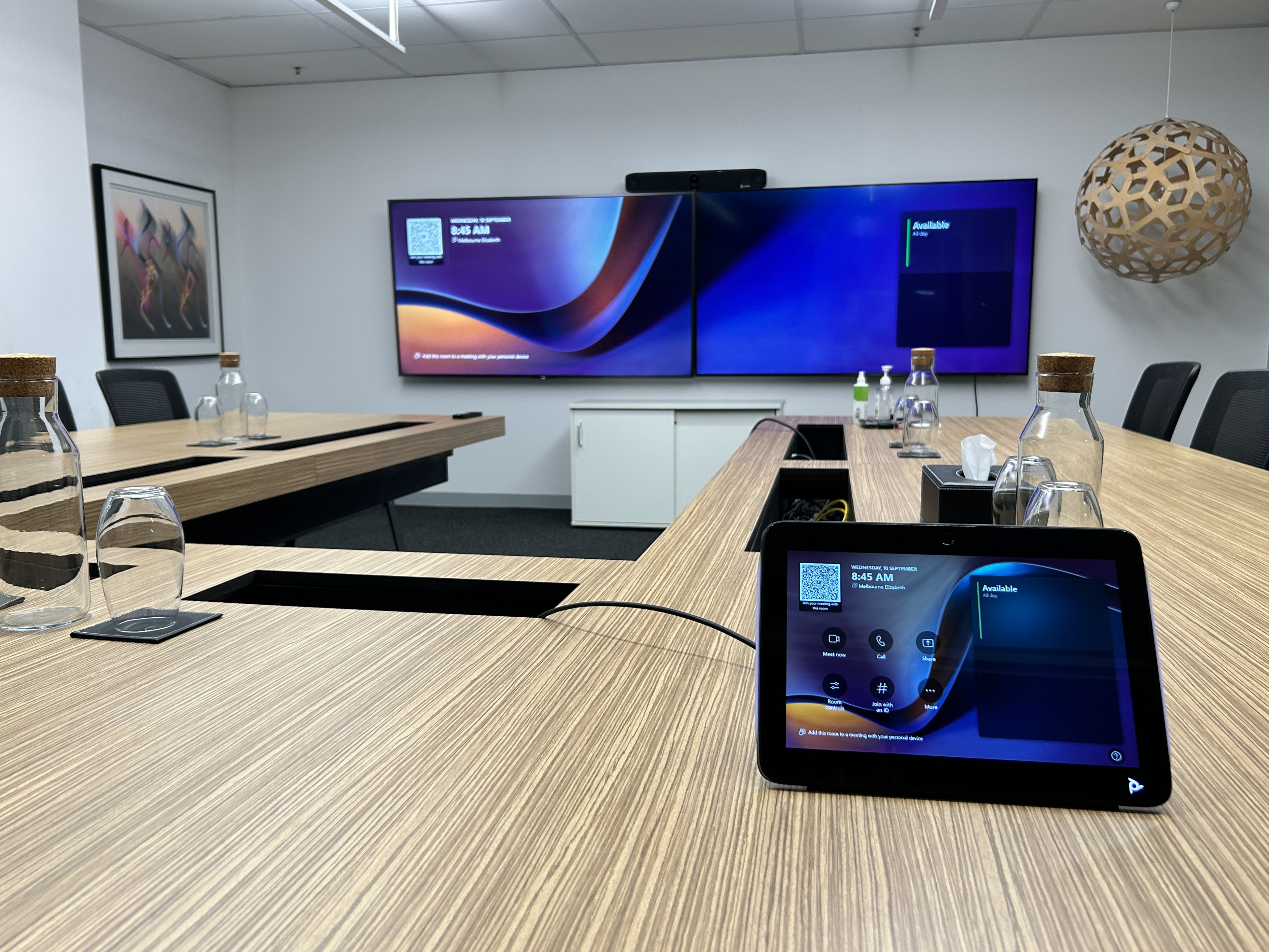 Large Microsoft Teams Room equipped with HP Poly X72 video bar, TC10 Touch Controller, 2x 65" displays