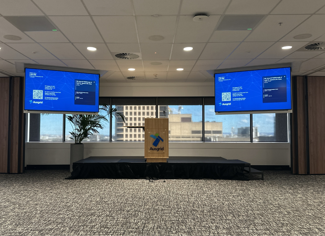 Large Microsoft Teams Town Hall and training space with 2x 86" LG displays on UltraLift motorised TV lifts