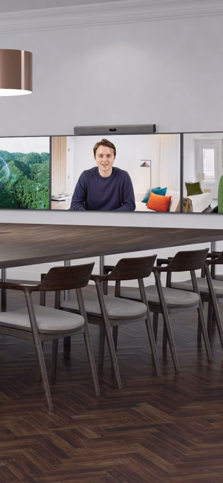 Zoom Rooms signature room with large meeting table and three wall-mounted displays