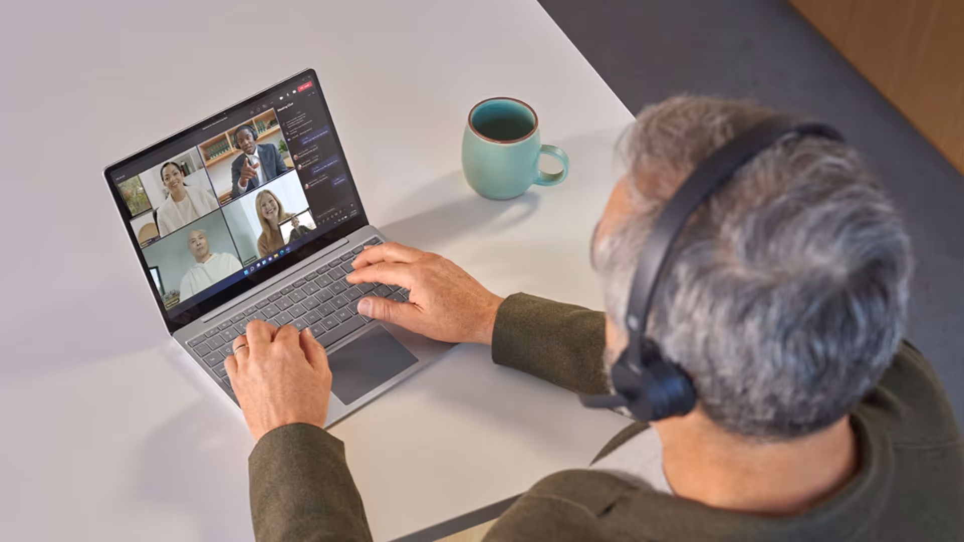 Man on a Microsoft Teams meeting on his laptop