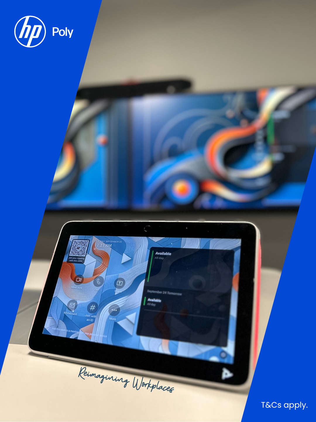 Poly TC10 Touch Controller on a meeting room table with two large monitors displaying colourful abstract art in the background.