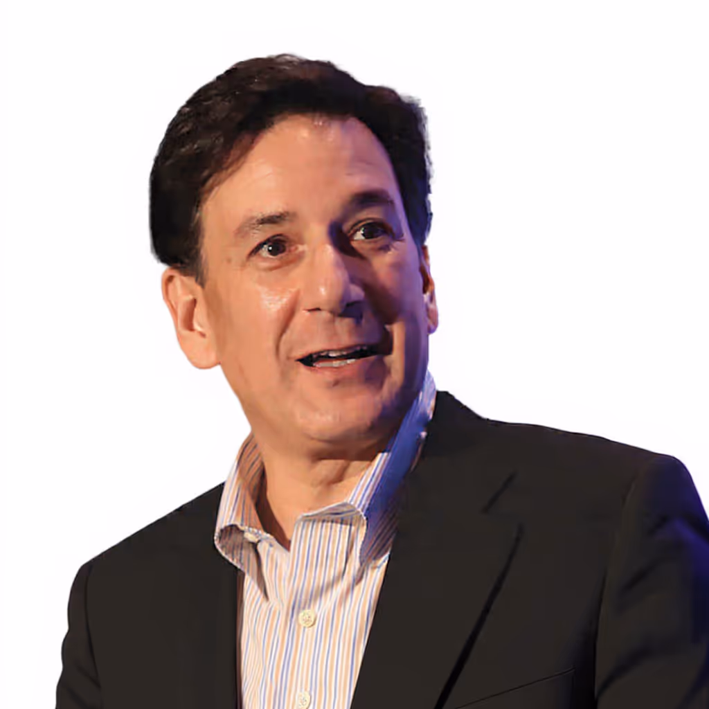 Larry speaking in a suit and striped shirt.