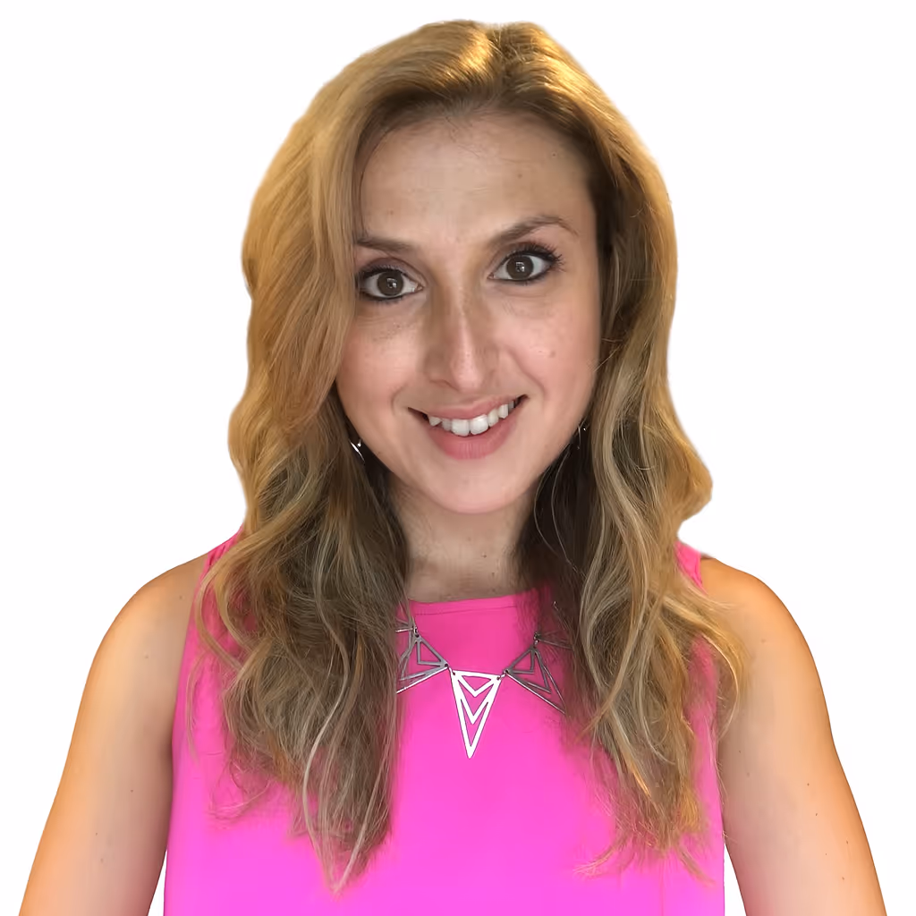 Headshot of Alyssa smiling in a pink top.