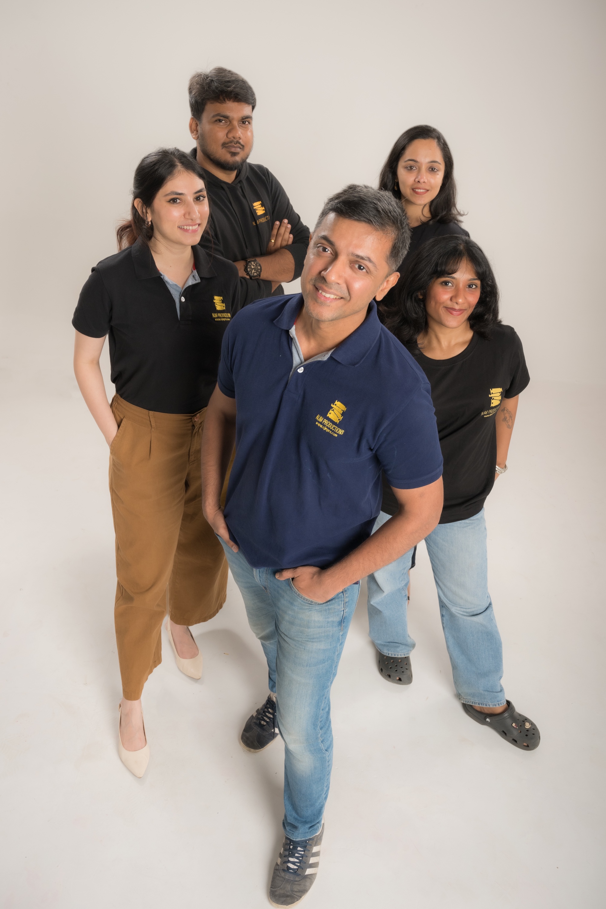 The NJM team photographed in their production shirts