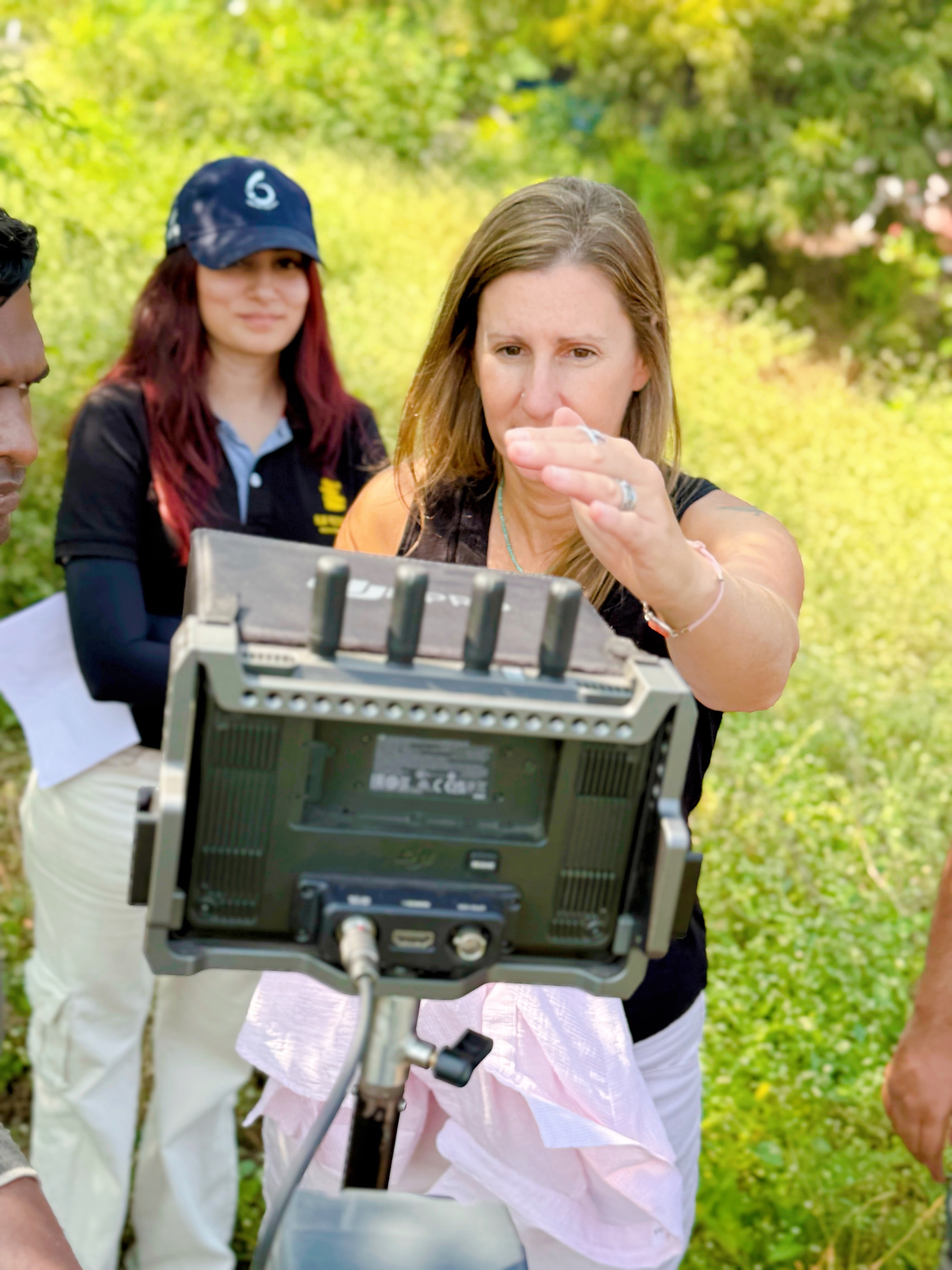 A filmmaker checking the production monitor