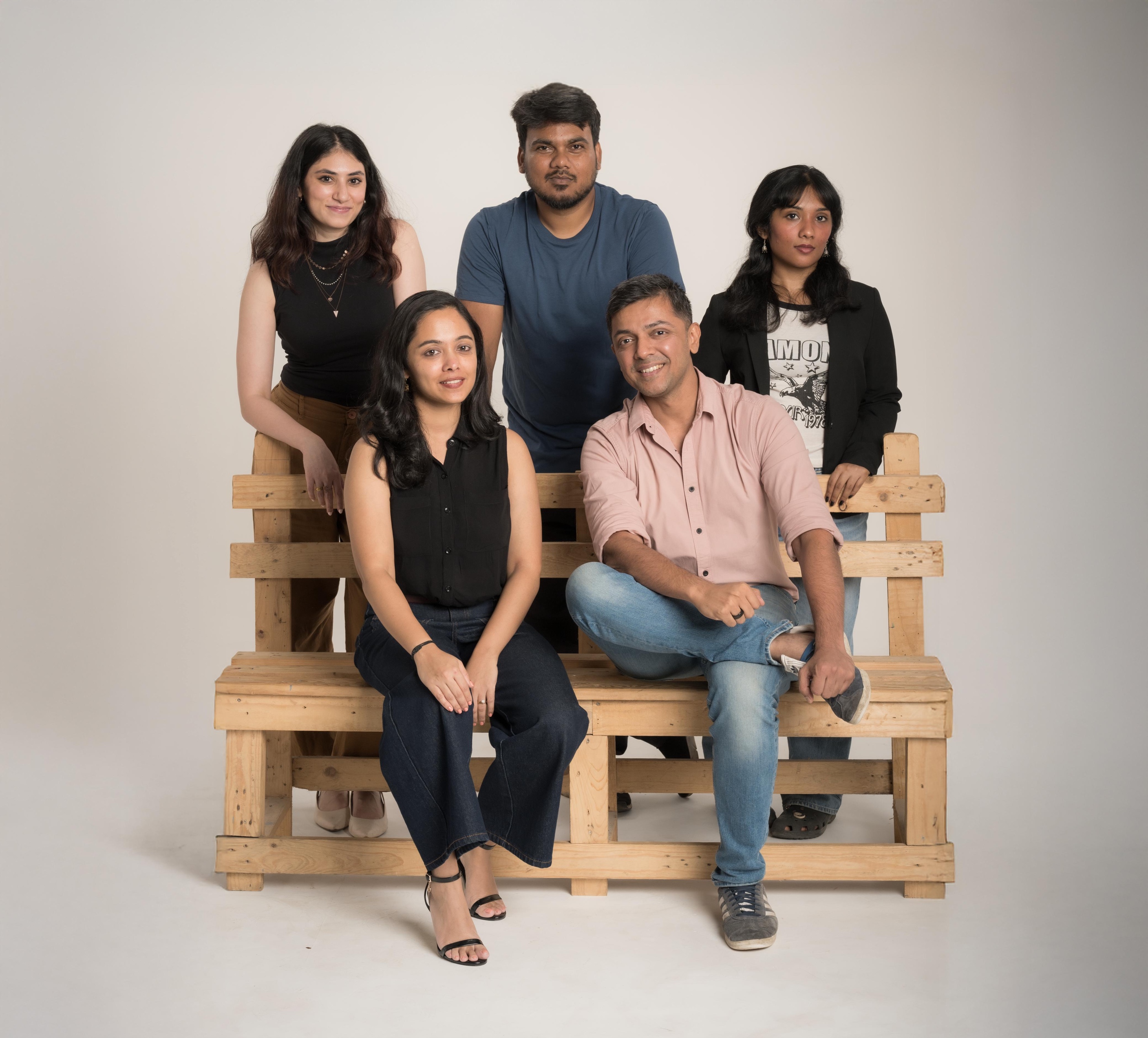 The NJM team seated together for a group portrait
