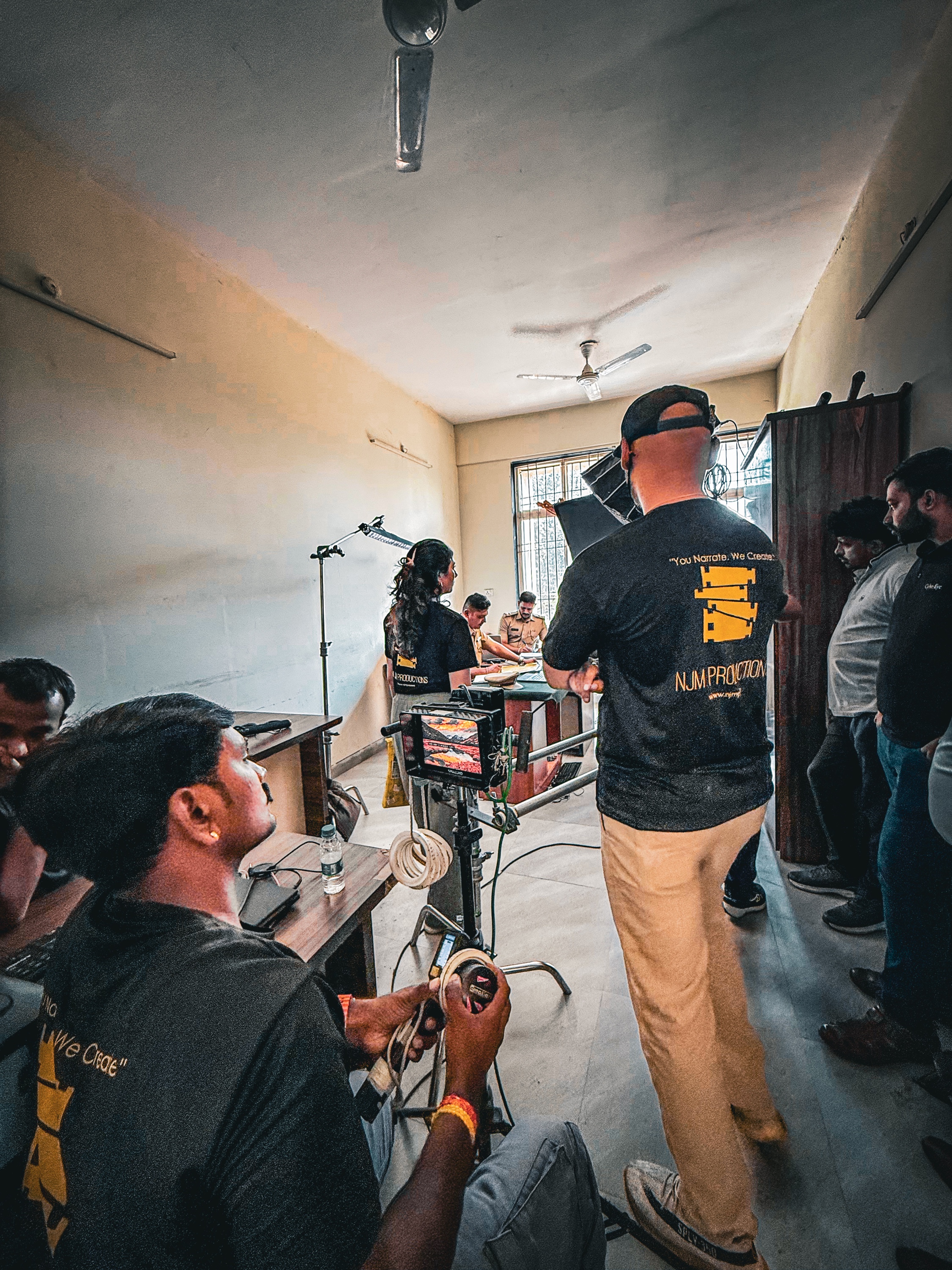 NJM crew filming an interior scene