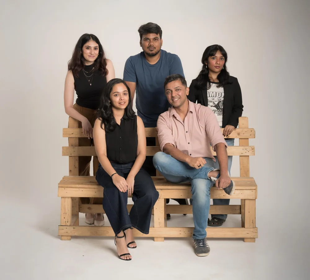 The NJM team seated together for a group portrait