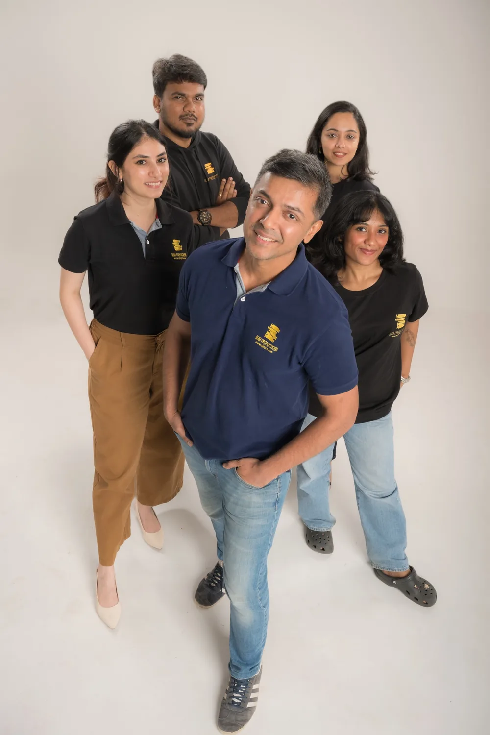 The NJM team photographed in their production shirts