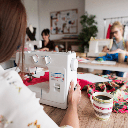 A student learning the fundamentals of sewing and alteration in TaF.tc's lastest sewing alteration project with NTUC LearningHub - AlterAround!