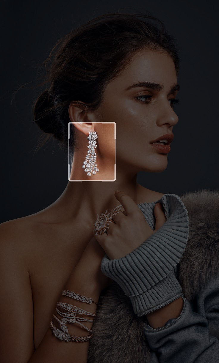 AI visual search zooming into luxury diamond earrings on model for jewelry identification and try-on.