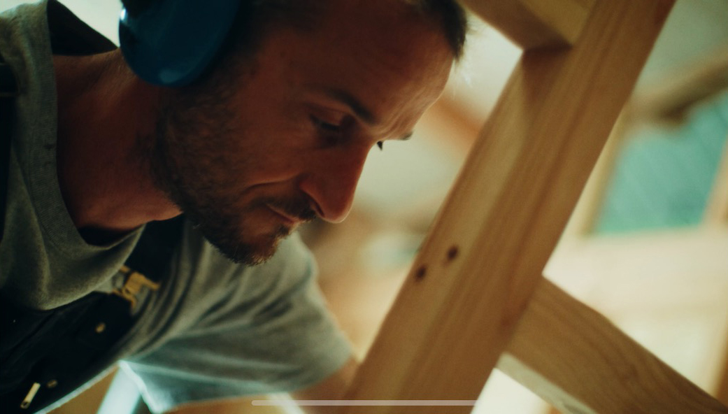 Sam Ludgate Bloom working on timber frame