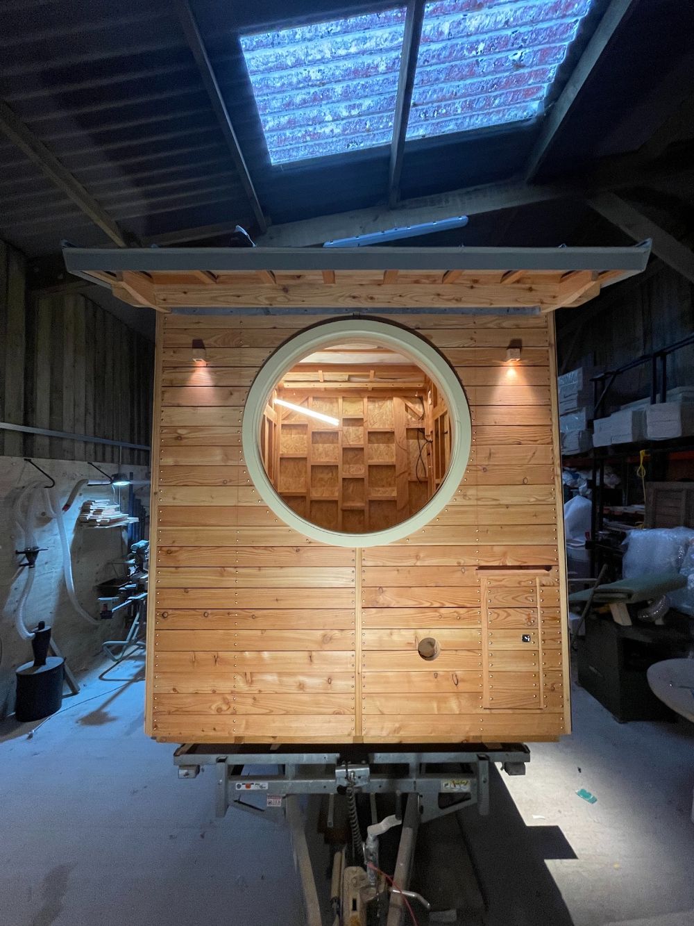 Circular picture window on Temple of Sweat sauna by Sam Ludgate Bloom