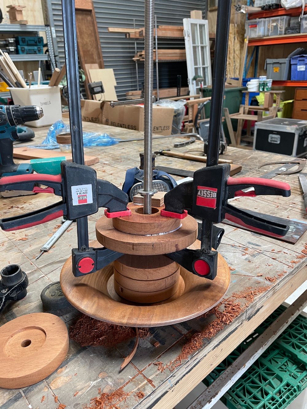 Fabrication of bespoke wooden light fitting in workshop.