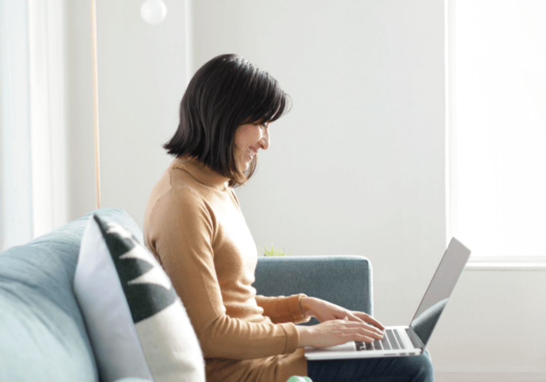 Woman sitting on a couch 
