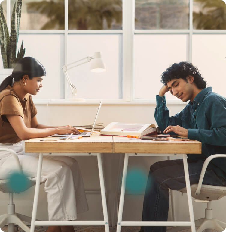 Woman and Man sitting at a desk
