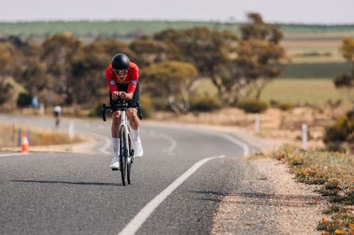 Three cyclists on podium