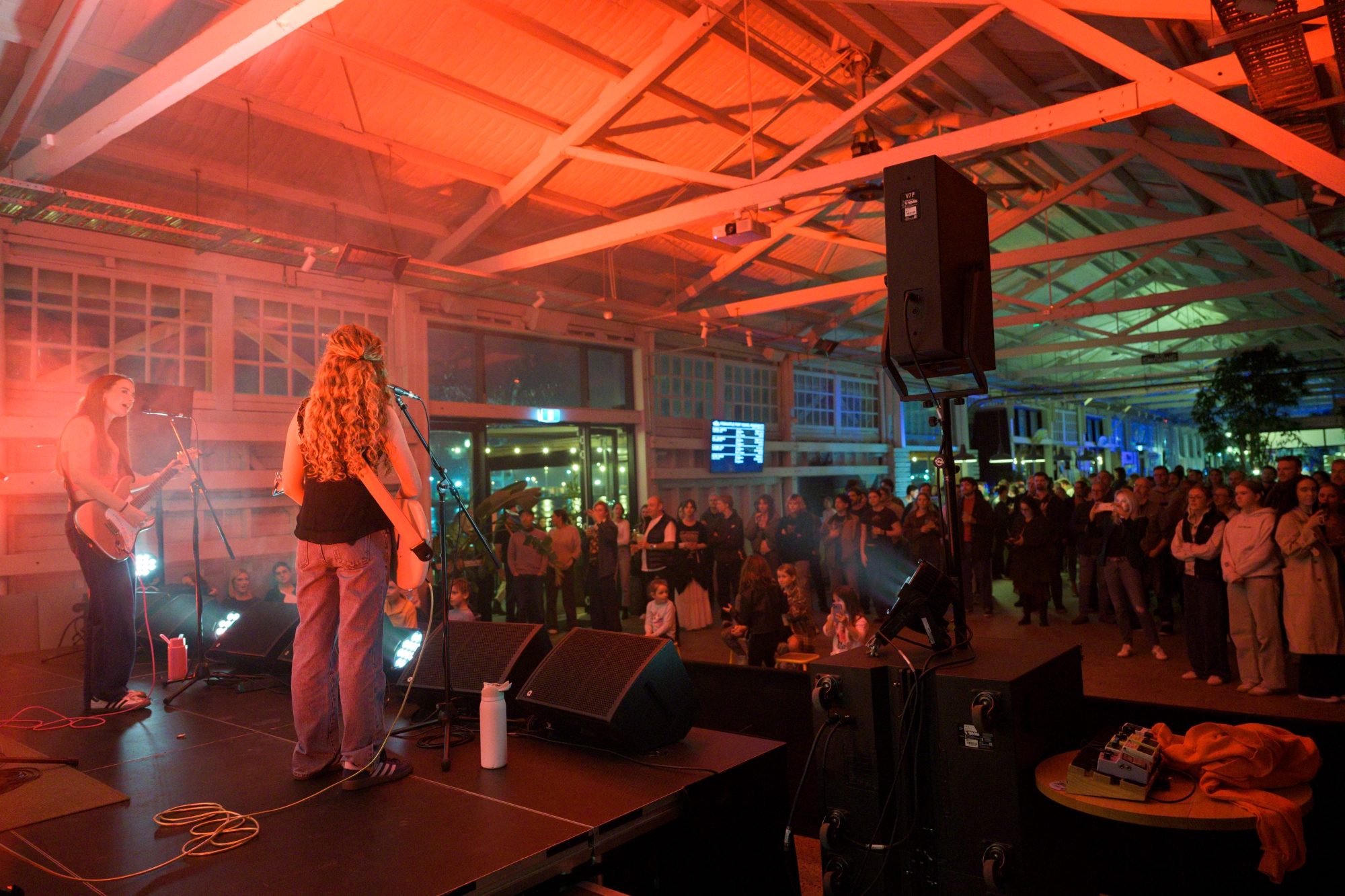 A band performing on stage at an indoor concert