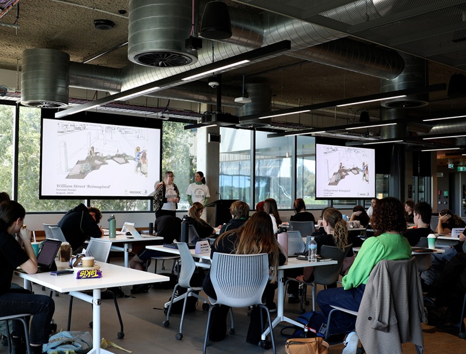 Student drawing with a stylus on a laptop