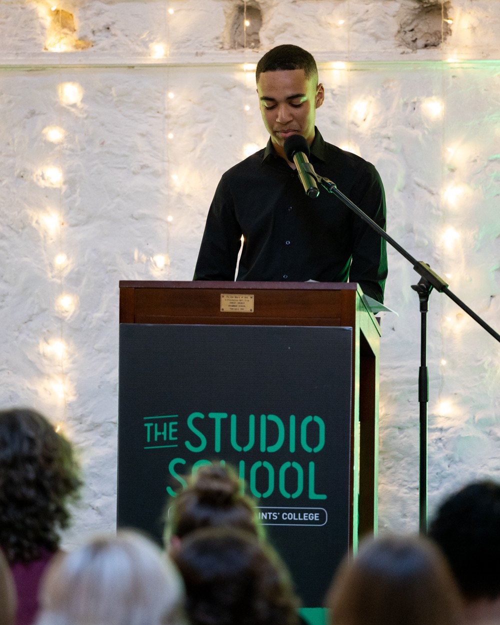 Male student presenting at graduation