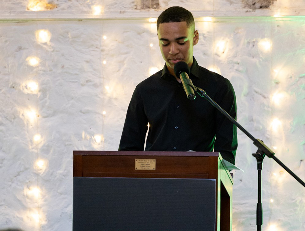 Male student presenting at graduation
