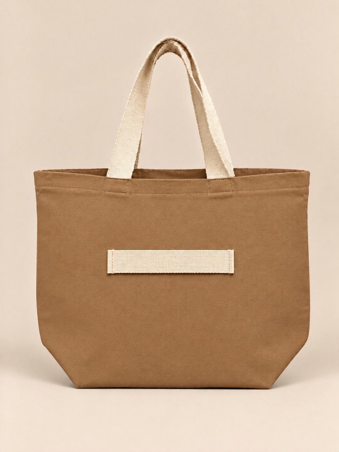 Brown Canvas cinch tote, studio with trolley sleeve