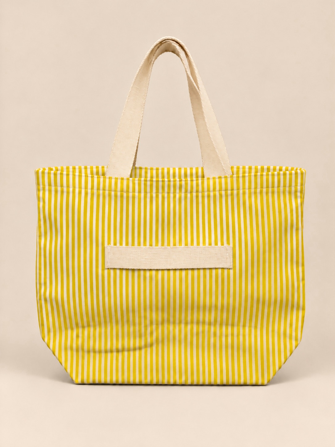 Yellow Stripes cinch tote, studio with trolley sleeve