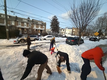 CH shoveling snow with neighbors