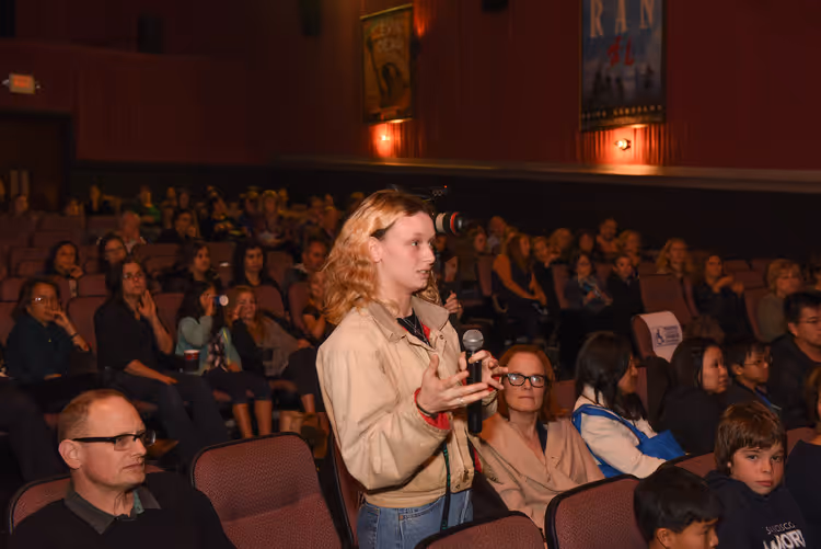 Audience Member asking a question at Screenagers Community Screening Event