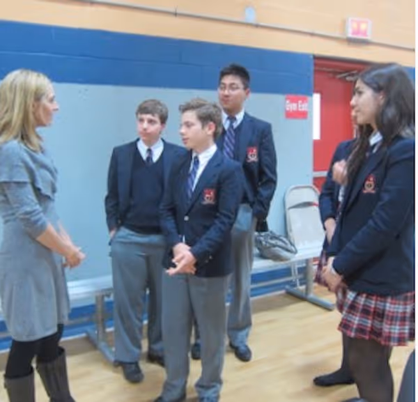 Filmmaker Delaney Ruston speaking to children at an event