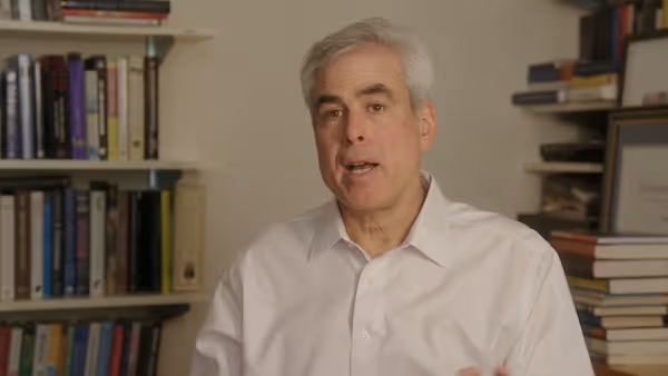 Jonathan Haidt wearing a white shirt speaking to camera