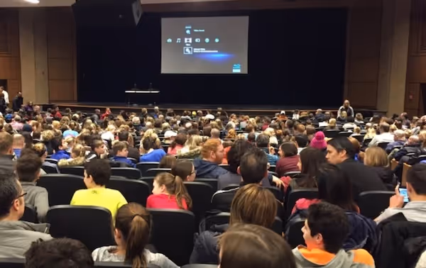 A busy school hall full of around 200 people about to watch the screenagers movie