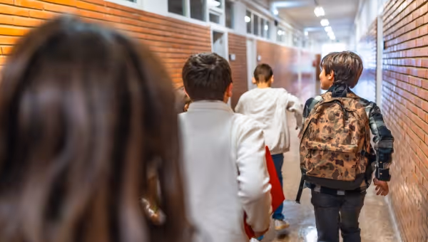 youth in a school hallway
