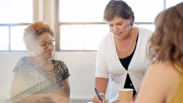 3 female teachers discussion in a training setting