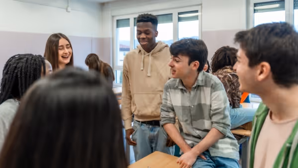 high school class students talking together