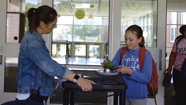 student handing in phone
