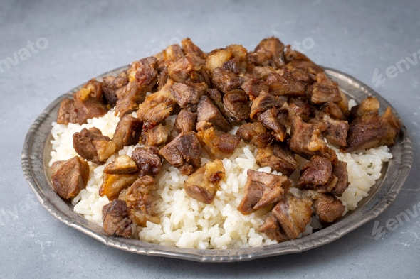 Traditional Turkish food; Roasted meat on rice (Turkish name; pilav üstü  kavurma, kurban kavurma) Stock Photo by esindeniz