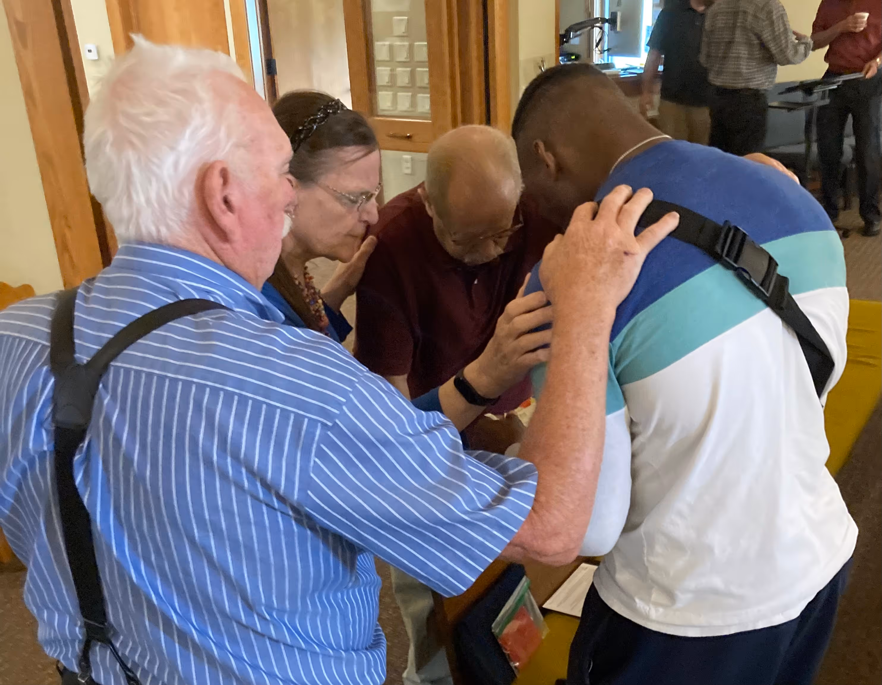 Man raising arms during worship service at Olivet Lutheran Church in La Crosse Wisconsin
