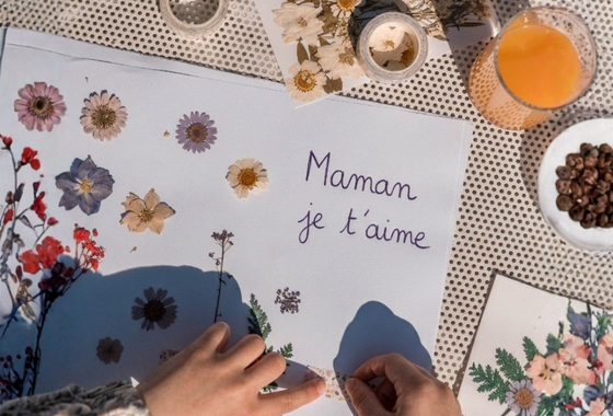 A child writes a poem titled "Mom, I Love You"