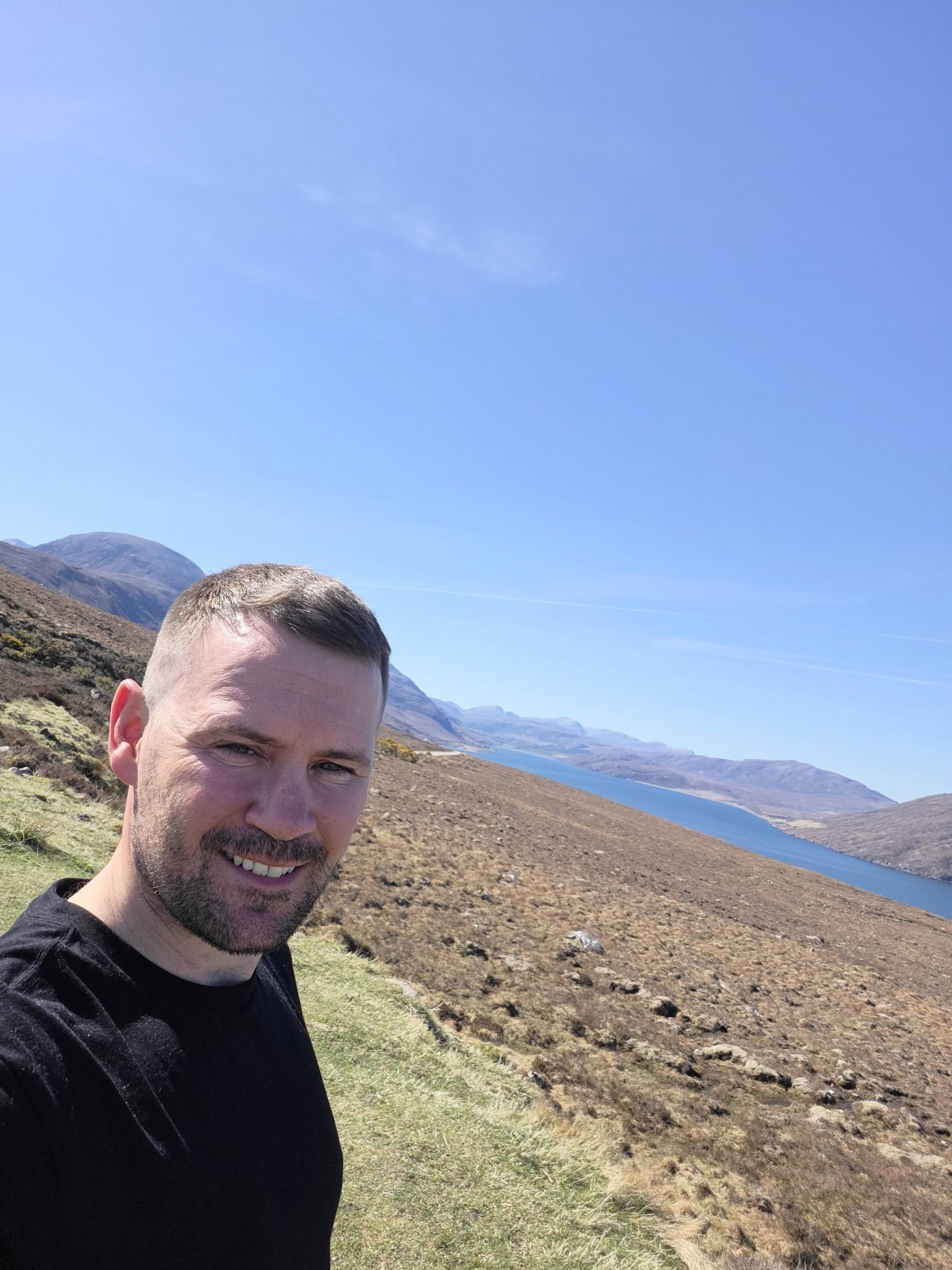 Steven Kelly overlooking a Highland valley during his North Coast 500 adventure in Scotland