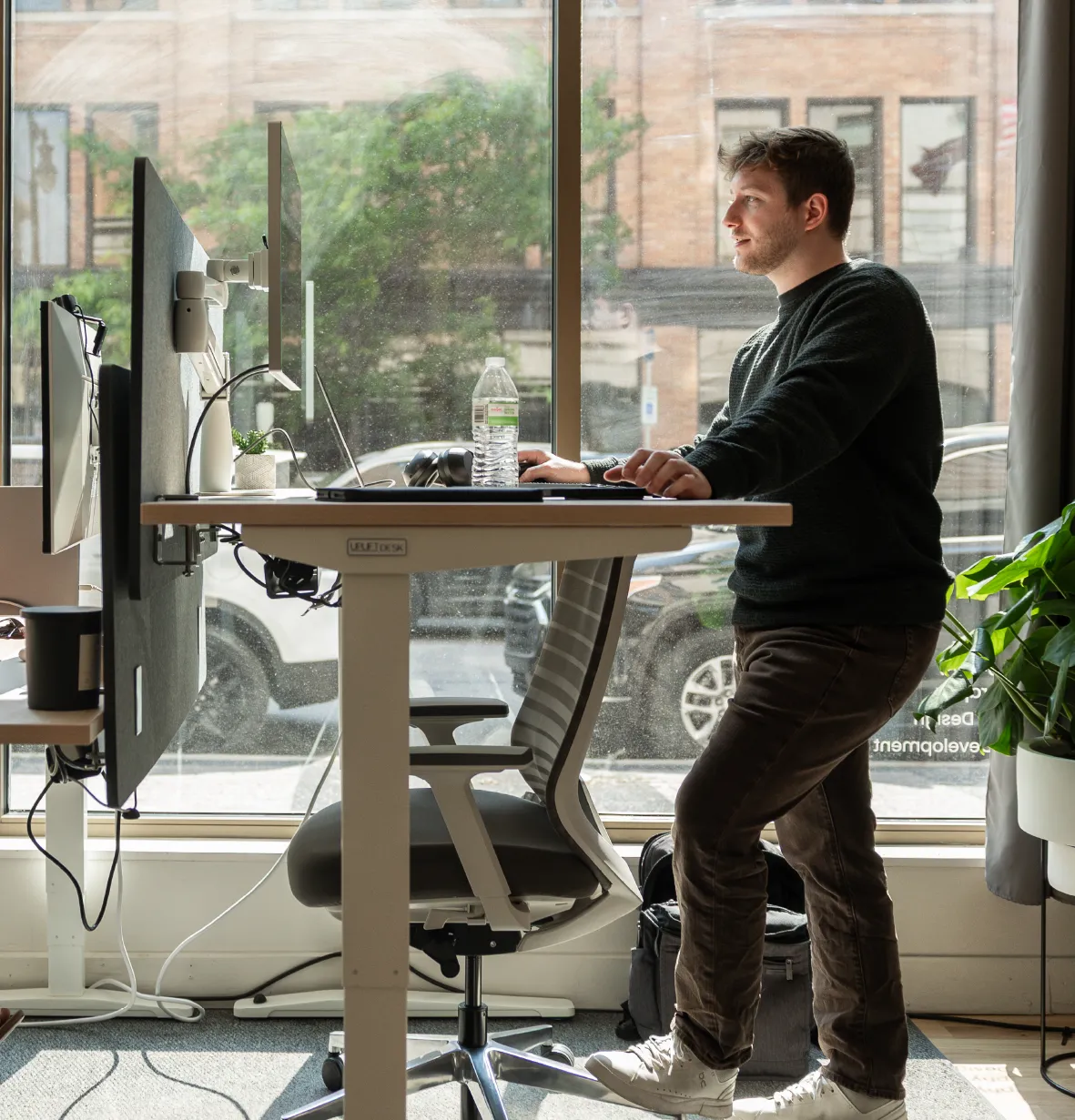 Launch Kit employee, Austin Johnson, working at the grand rapids marketing office on digital advertising.