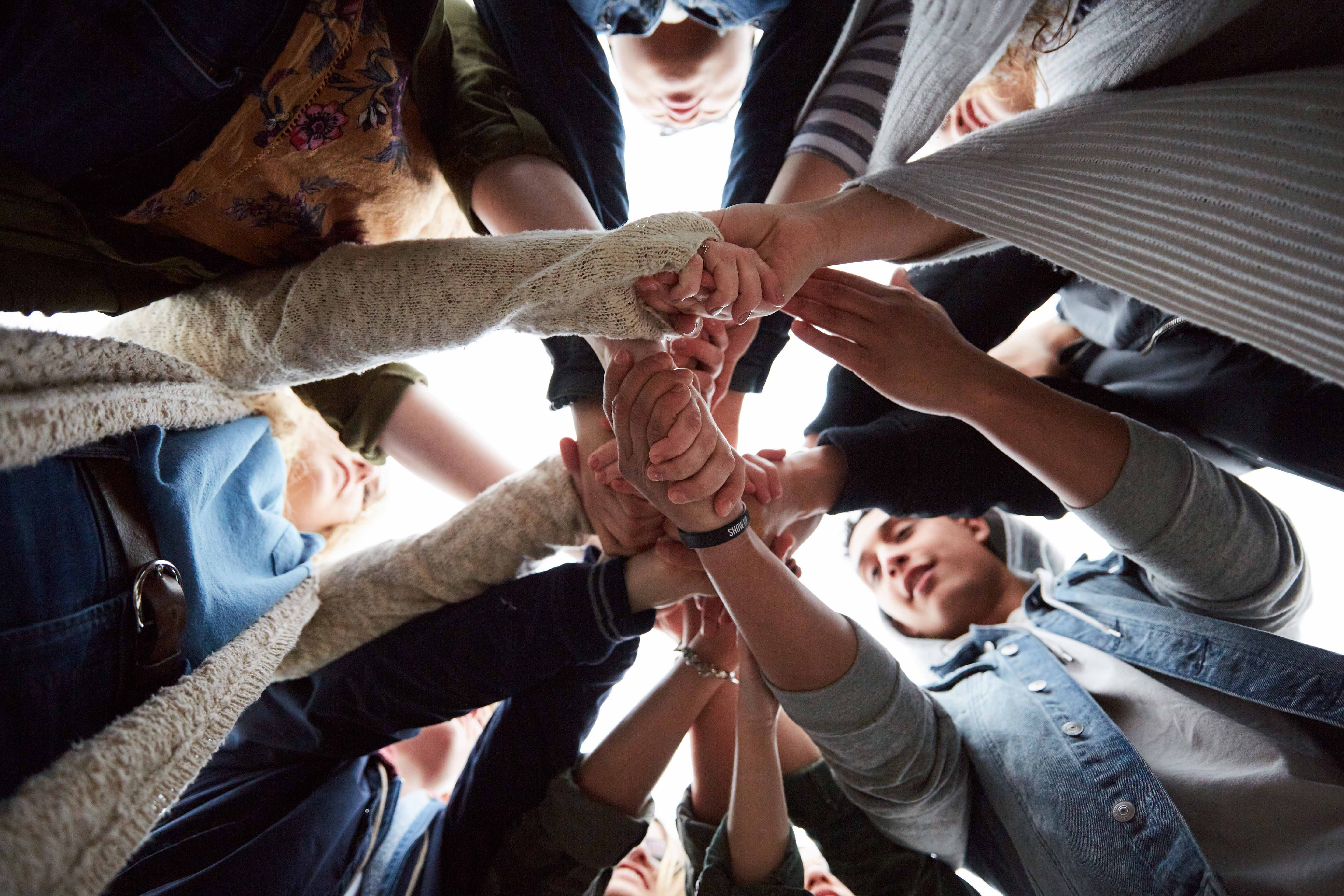 Teens huddled together