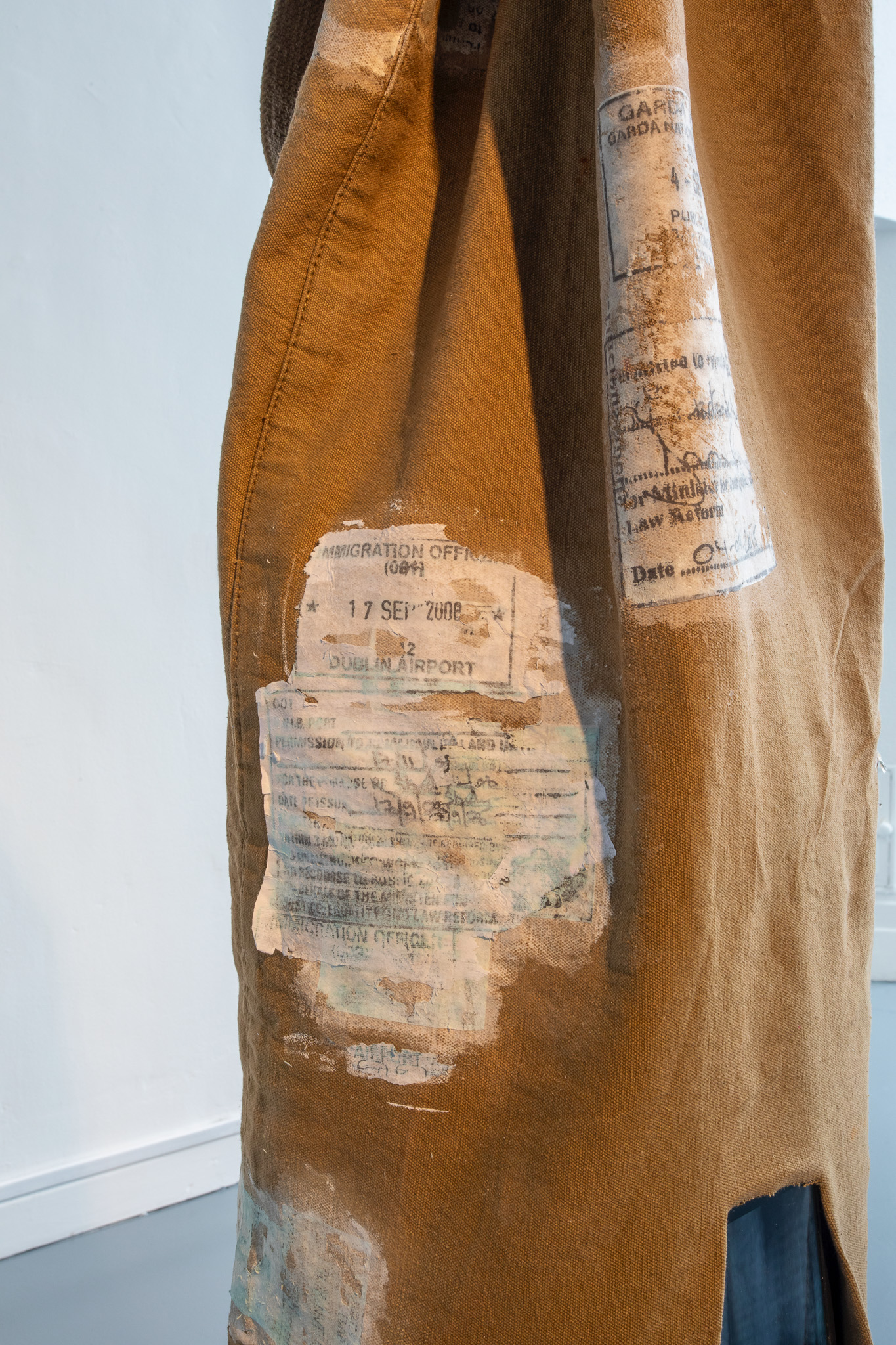 Detail -Nesting Brood Parasites (2023) land: acrylic transfer print on vintage dufflebag, moving image on mobile