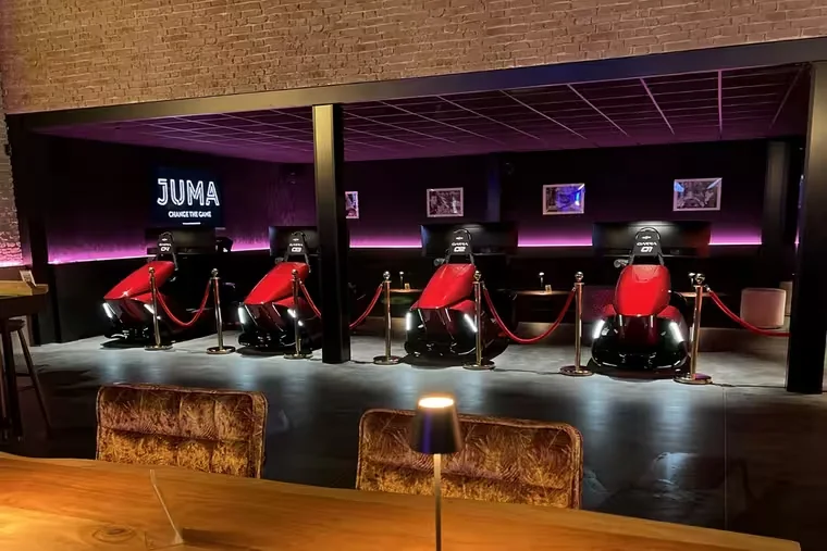 The ImSim racing zone at JUMA, with a row of red simulators.