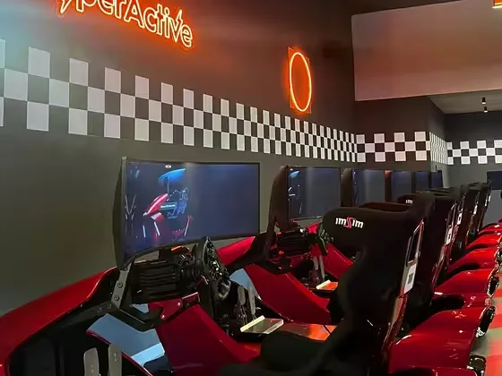 The row of red GARRA simulators in the racing zone at HyperActive, Pristina.