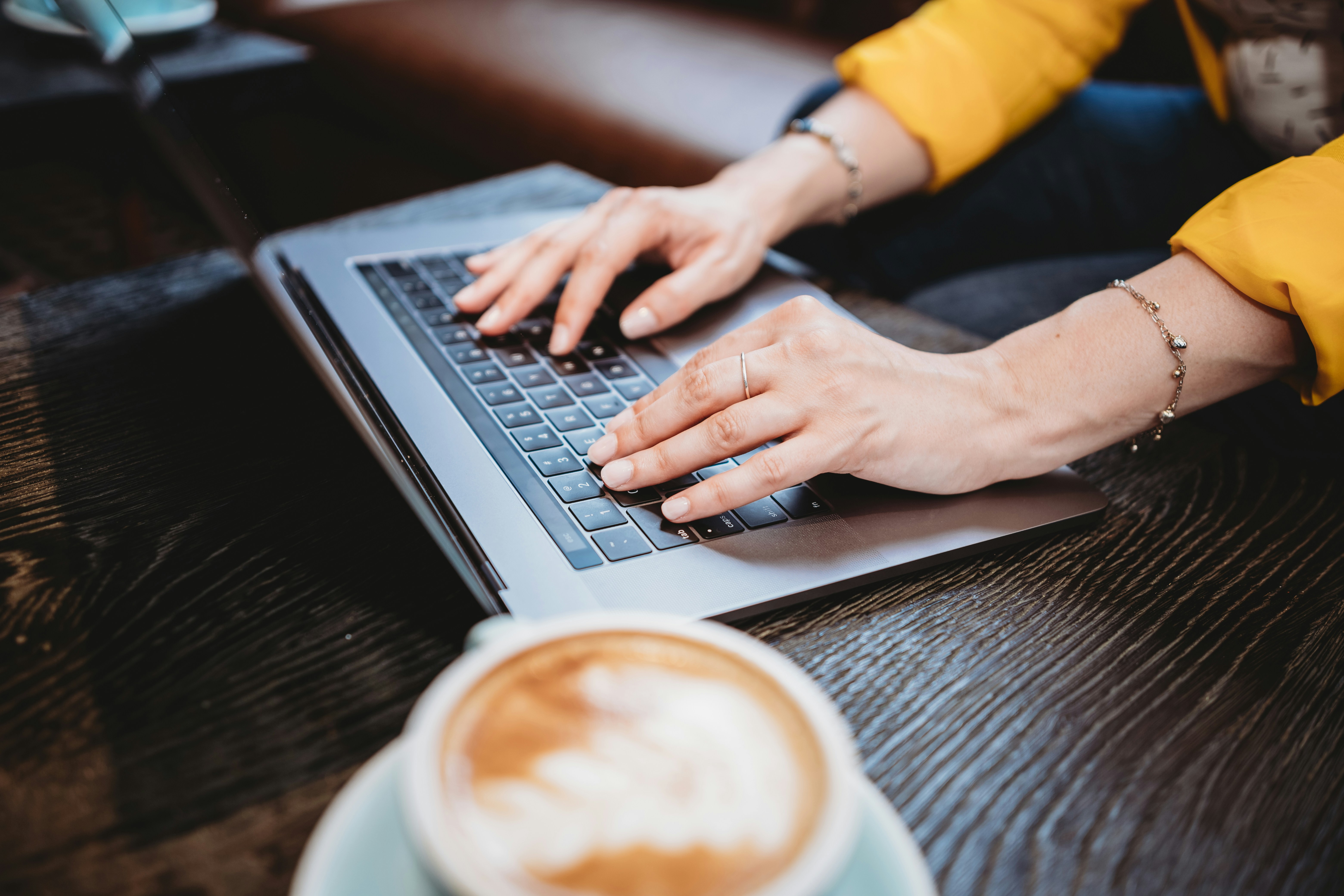 woman working on a laptop - Webflow Analytics